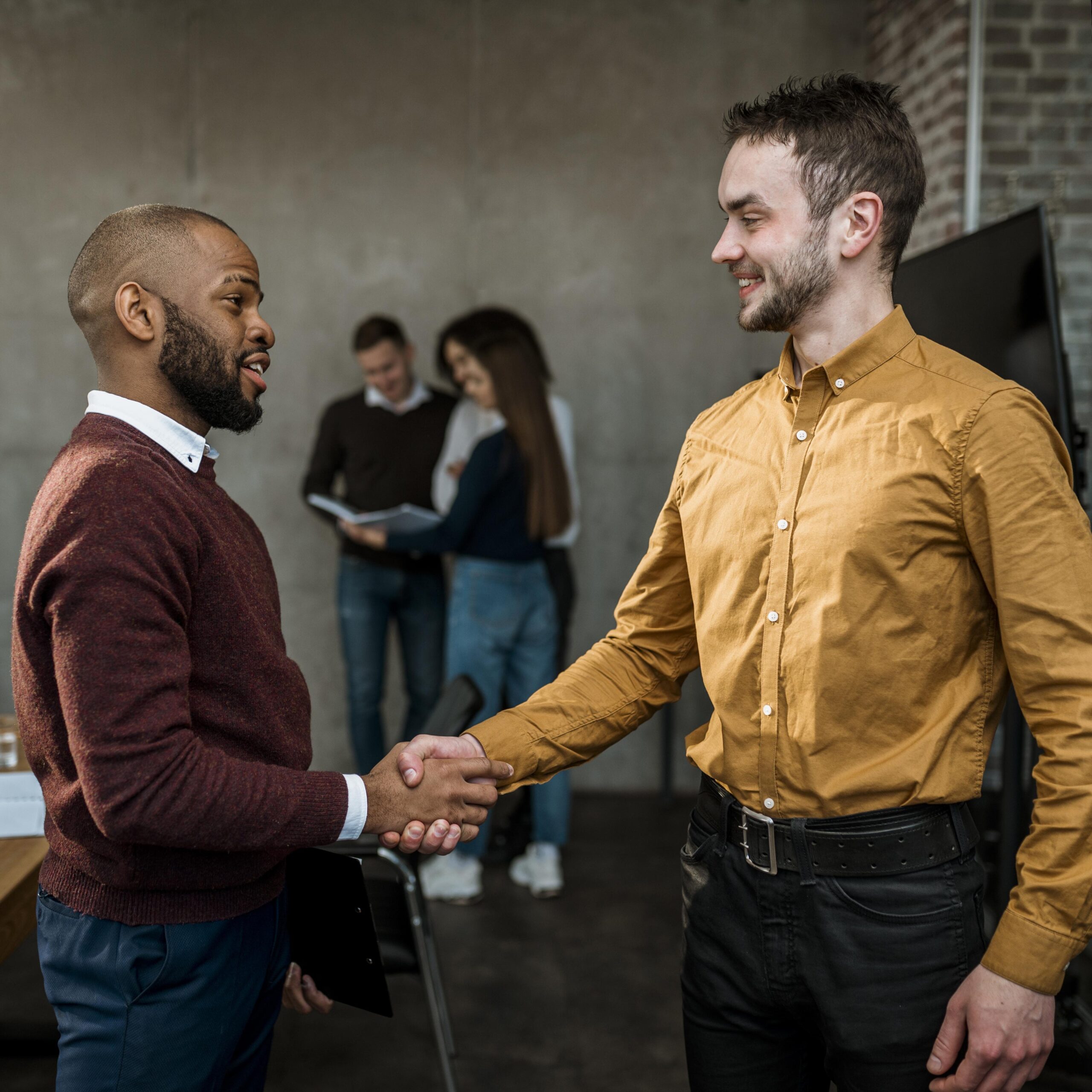 side-view-men-handshaking-agreement-after-meeting